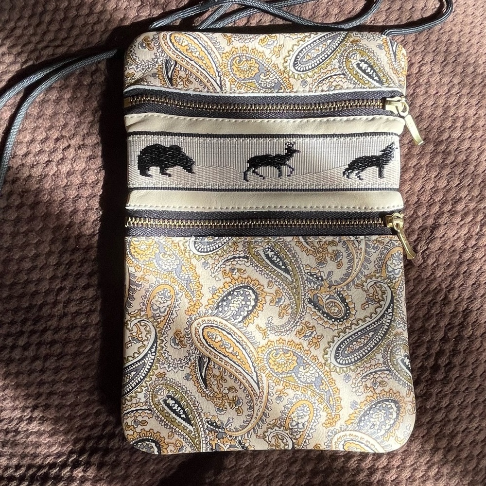 Raw leather cross body bag